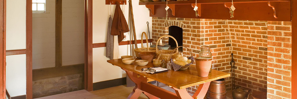 Table with backets and ingredients in historical style kitchen : Photo